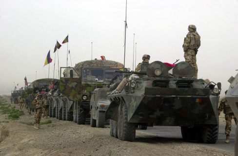 A Romanian Army B33 (8X8) Armored Personnel Carrier (APC) leads a convoy of multi-national vehicles from Kandahar Airfield to Kabul, the capital of Afghanistan. The purpose of the convoy is to gather information and to help with a road reconstruction project in Afghanistan during Operation ENDURING FREEDOM.